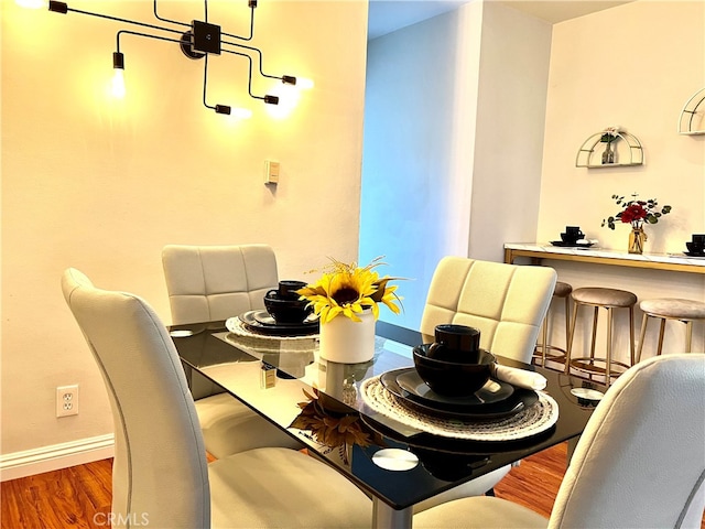 dining space featuring dark hardwood / wood-style flooring