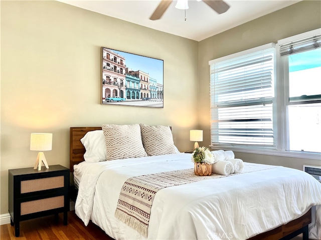 bedroom featuring ceiling fan and dark hardwood / wood-style flooring