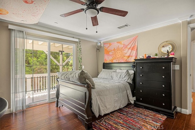 bedroom with ornamental molding, dark hardwood / wood-style flooring, ceiling fan, and access to exterior