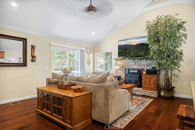 living room with ornamental molding, a wood stove, lofted ceiling, and dark hardwood / wood-style flooring