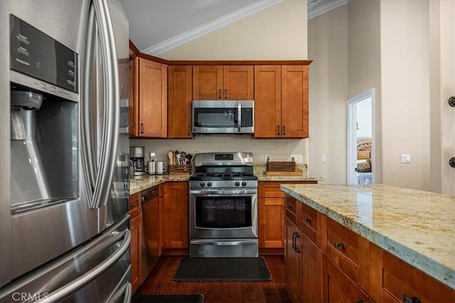 kitchen with light stone countertops, appliances with stainless steel finishes, crown molding, and dark wood-type flooring