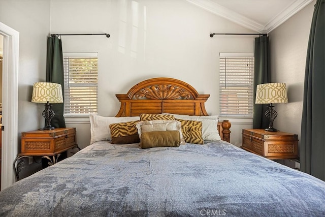 bedroom with crown molding and vaulted ceiling