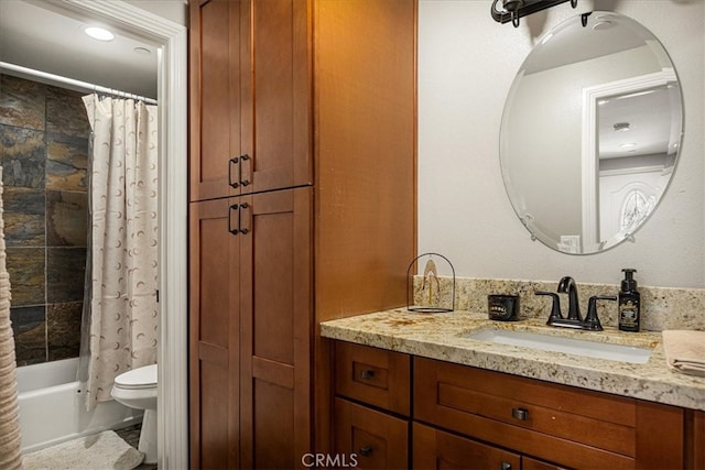 full bathroom with shower / bath combination with curtain, vanity, and toilet