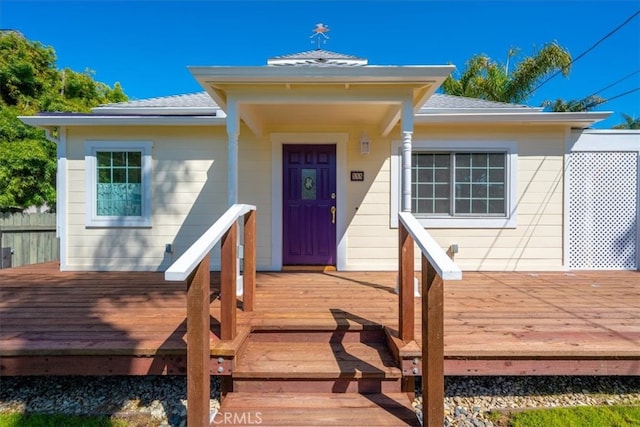 entrance to property with a deck