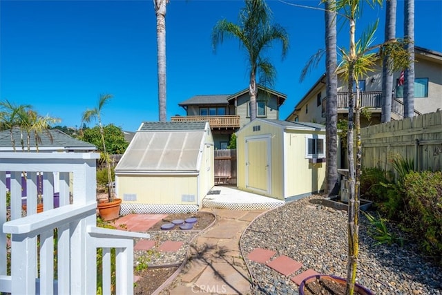 exterior space featuring a shed and a patio