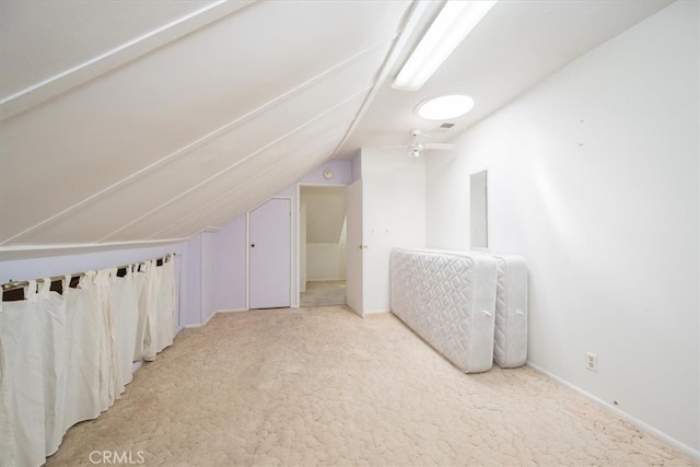 additional living space with carpet floors, lofted ceiling, and ceiling fan