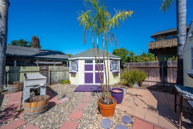 555 Le Point St, Arroyo Grande, CA 93420 - view of patio / terrace with a fenced backyard, a storage unit, and an outdoor structure