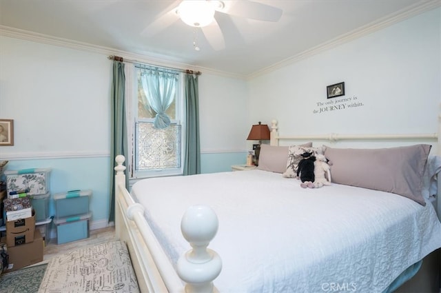 bedroom with ceiling fan and ornamental molding