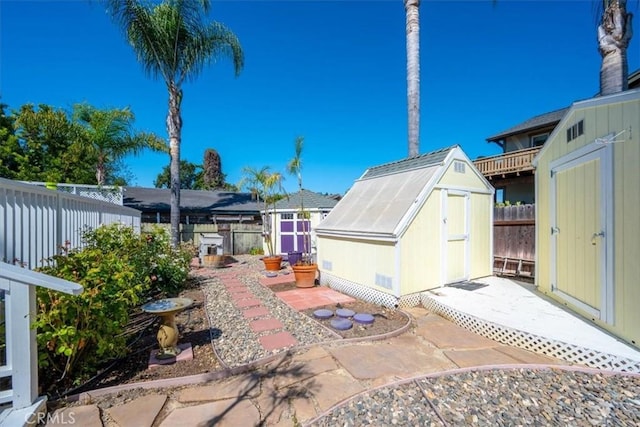 555 Le Point St, Arroyo Grande, CA 93420 - view of patio with an outdoor structure, a fenced backyard, and a shed