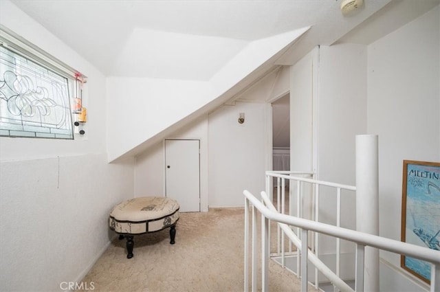 hallway with light colored carpet