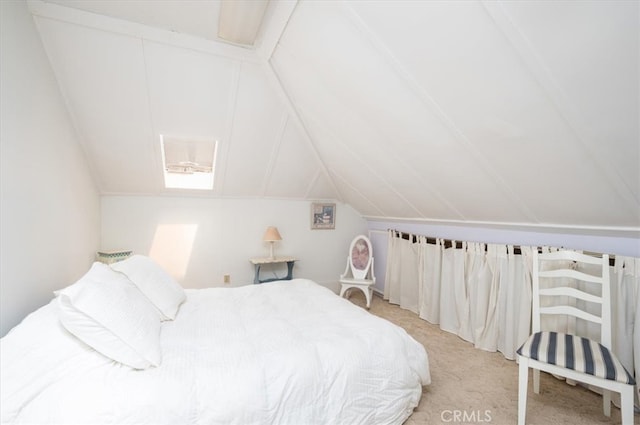 bedroom with lofted ceiling and light colored carpet