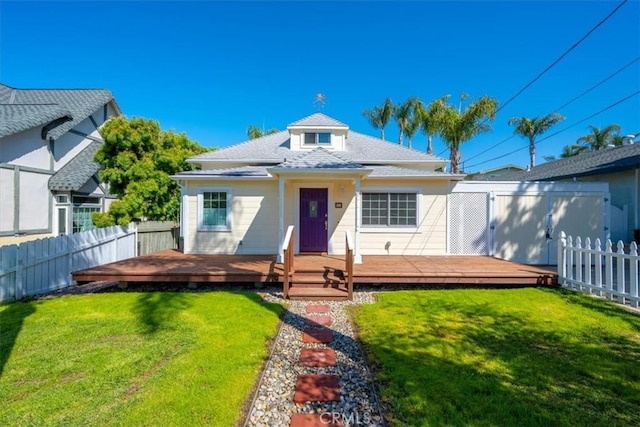 555 Le Point St, Arroyo Grande, CA 93420 - view of front of house featuring a fenced backyard, a wooden deck, a shingled roof, and a front lawn