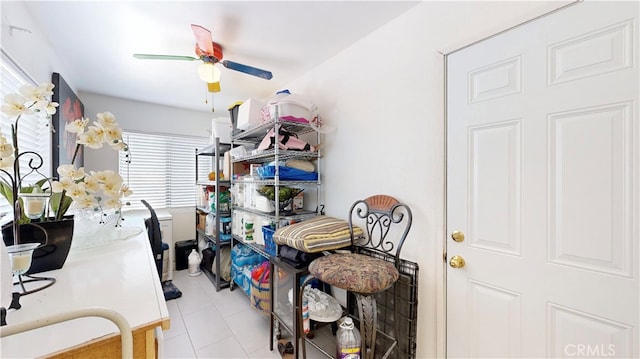 interior space featuring ceiling fan and light tile patterned floors