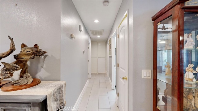 corridor with light tile patterned flooring