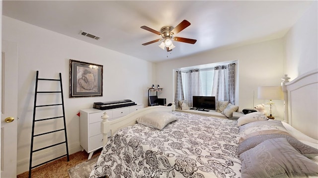 bedroom featuring ceiling fan and light colored carpet