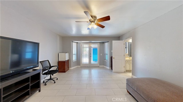 office area with french doors, ceiling fan, and light tile patterned floors