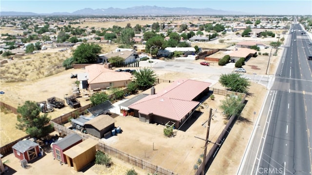 birds eye view of property with a mountain view