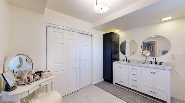 bathroom featuring tile patterned floors and vanity