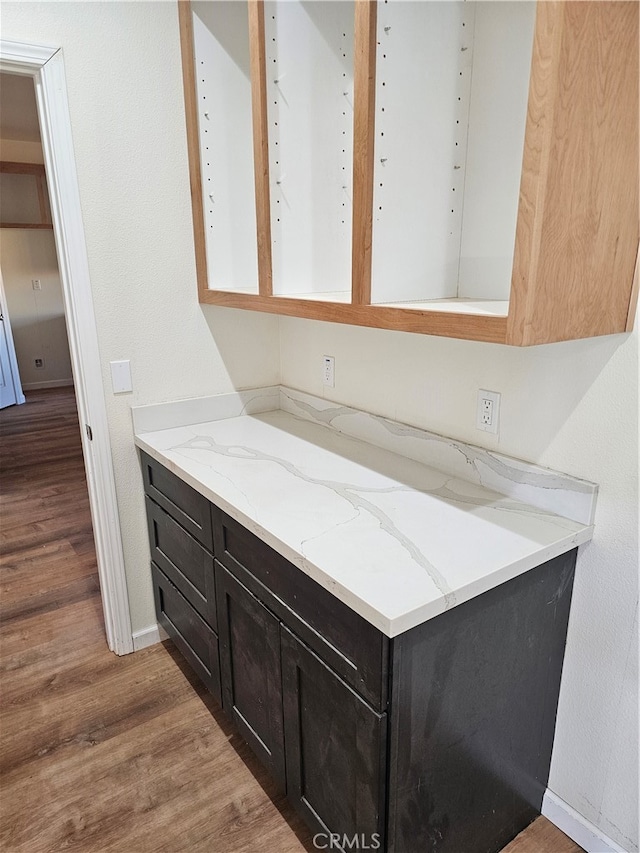 bathroom with wood-type flooring and vanity