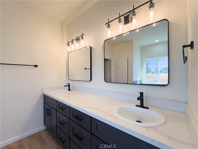 bathroom featuring hardwood / wood-style flooring and vanity