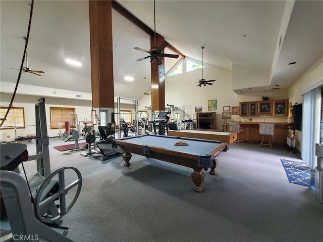 playroom with pool table, high vaulted ceiling, and bar area