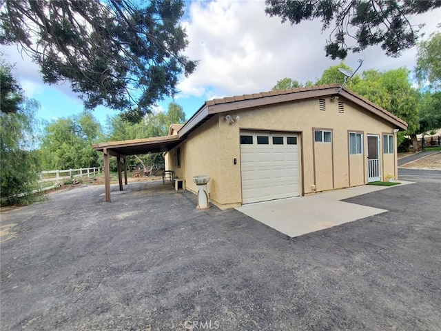 garage featuring a carport