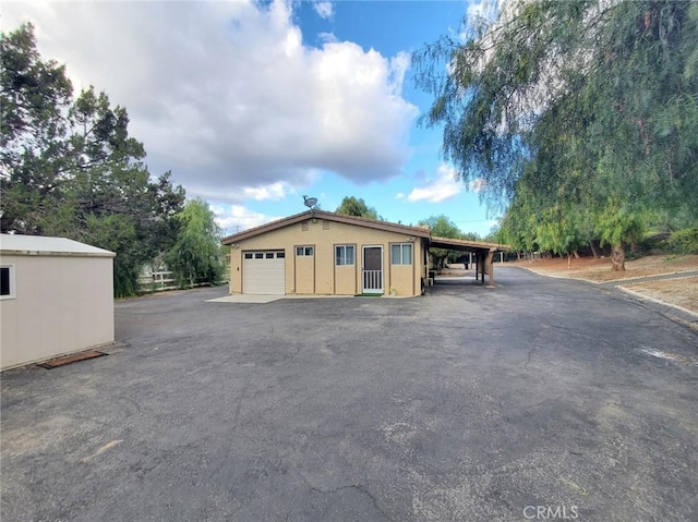 garage featuring a carport