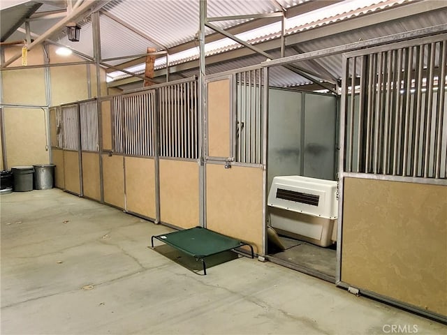 view of horse barn with heating unit