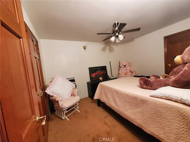 carpeted bedroom with a closet and ceiling fan