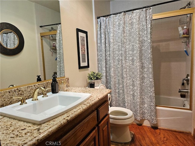 full bathroom with vanity, hardwood / wood-style flooring, toilet, and shower / bathtub combination with curtain