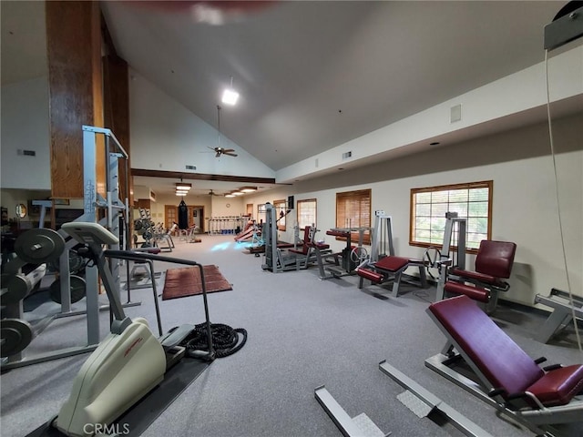 gym with high vaulted ceiling and ceiling fan