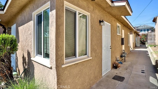 view of side of property featuring a patio area