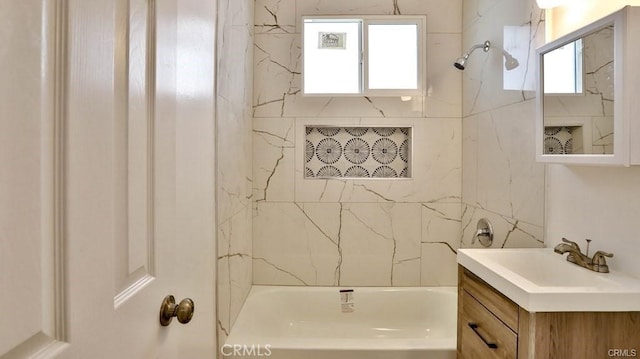 bathroom with shower / bathtub combination and vanity