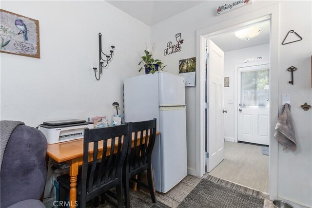 dining room with hardwood / wood-style flooring