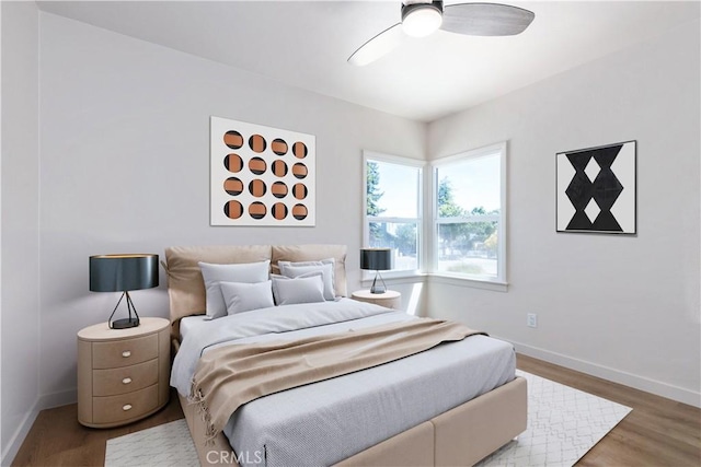 bedroom featuring hardwood / wood-style floors and ceiling fan