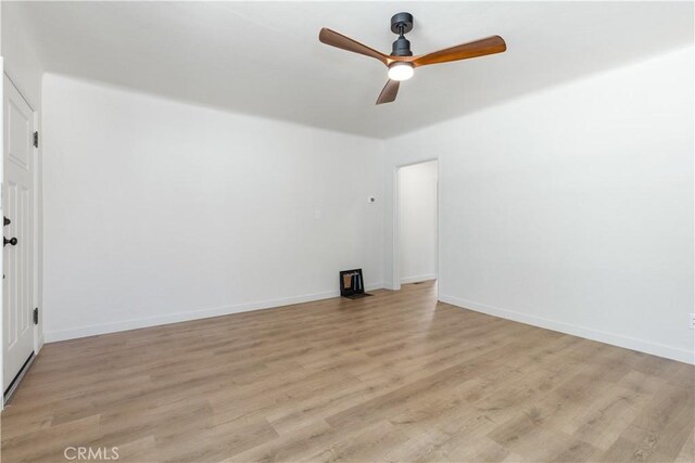 spare room with light hardwood / wood-style flooring and ceiling fan