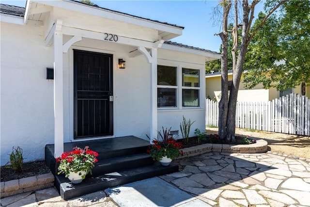 doorway to property with a patio area