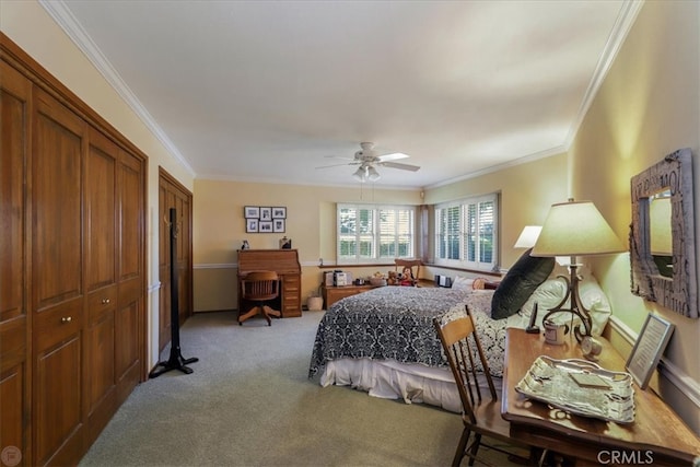 carpeted bedroom featuring ceiling fan and crown molding