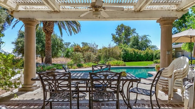 view of pool featuring a pergola, ceiling fan, and a patio area