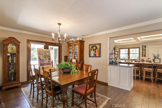 dining room featuring a notable chandelier, crown molding, and dark wood-type flooring