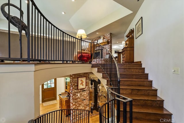 stairs featuring hardwood / wood-style flooring