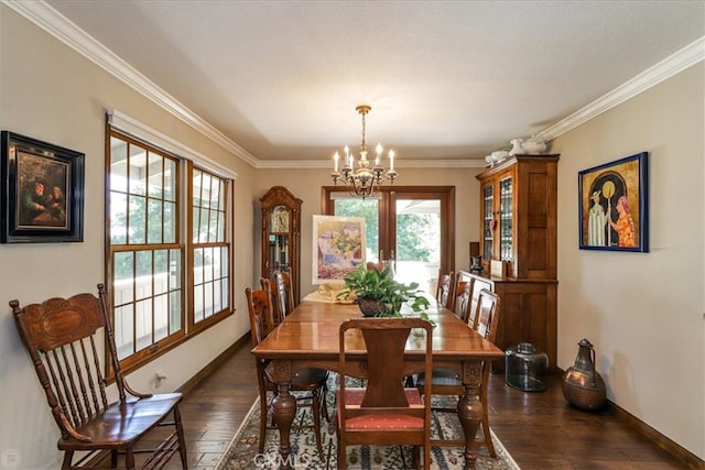 dining space featuring an inviting chandelier, dark hardwood / wood-style floors, french doors, and crown molding