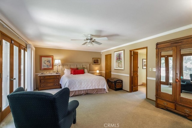 carpeted bedroom with multiple windows, ceiling fan, and french doors