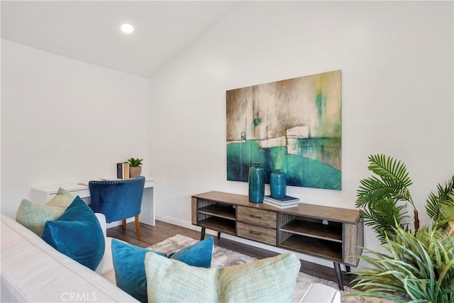 living area featuring lofted ceiling, baseboards, wood finished floors, and recessed lighting