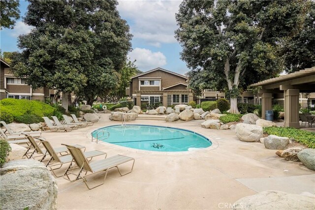 pool with a patio area