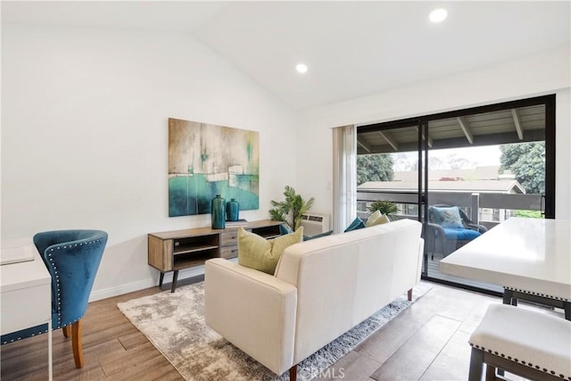 living room featuring vaulted ceiling, recessed lighting, wood finished floors, and baseboards