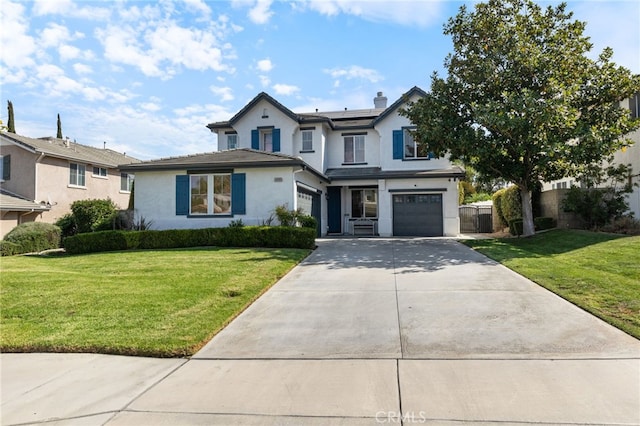 view of front of house with a front lawn and a garage