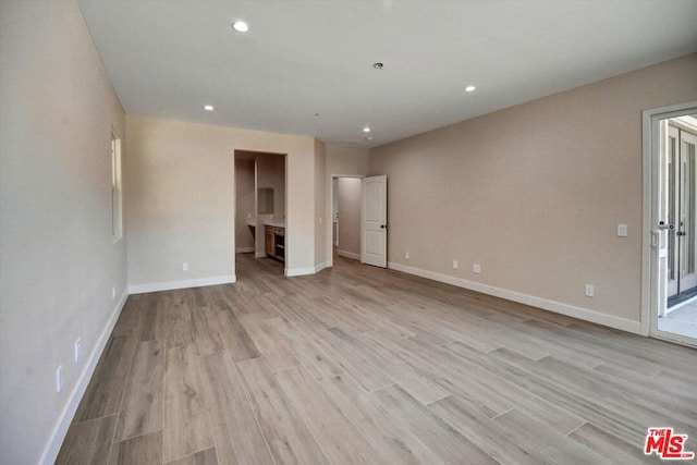 unfurnished living room featuring light hardwood / wood-style floors