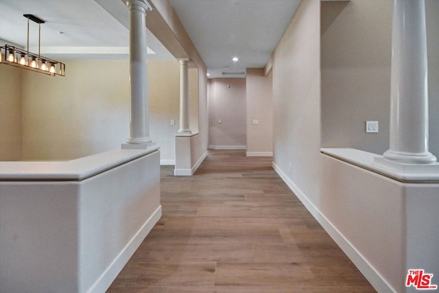 hallway with light hardwood / wood-style flooring