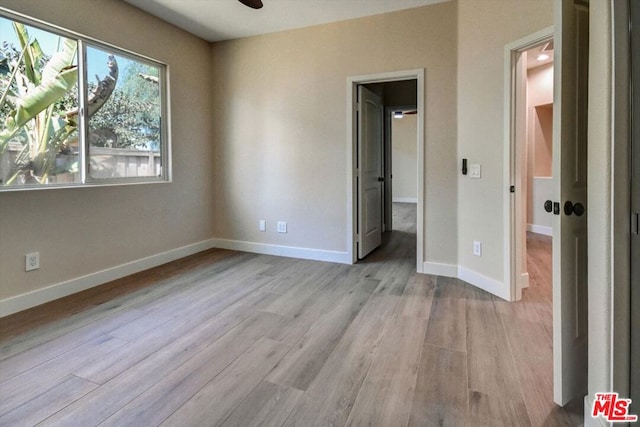 unfurnished bedroom with light hardwood / wood-style floors